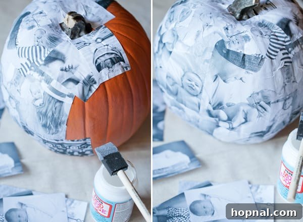 A stunning decoupage craft pumpkin displaying a collage of baby photos, highlighting the rustic texture and unique design.