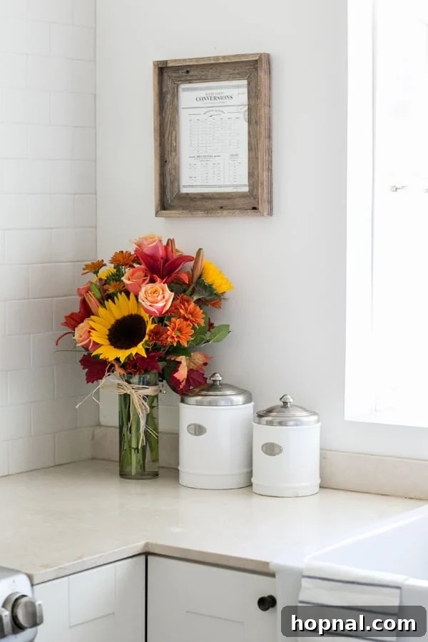 Stylish Printable Kitchen Conversion Guide 4 A charming kitchen conversion chart framed with fresh flowers, ready for printing and display in any kitchen.
