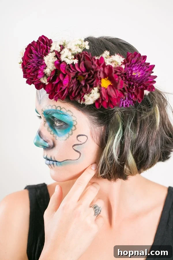 Effortless Día de los Muertos Makeup & DIY Flower Crown Guide 3 Model with stunning Day of the Dead inspired makeup featuring delicate patterns and a dark floral crown