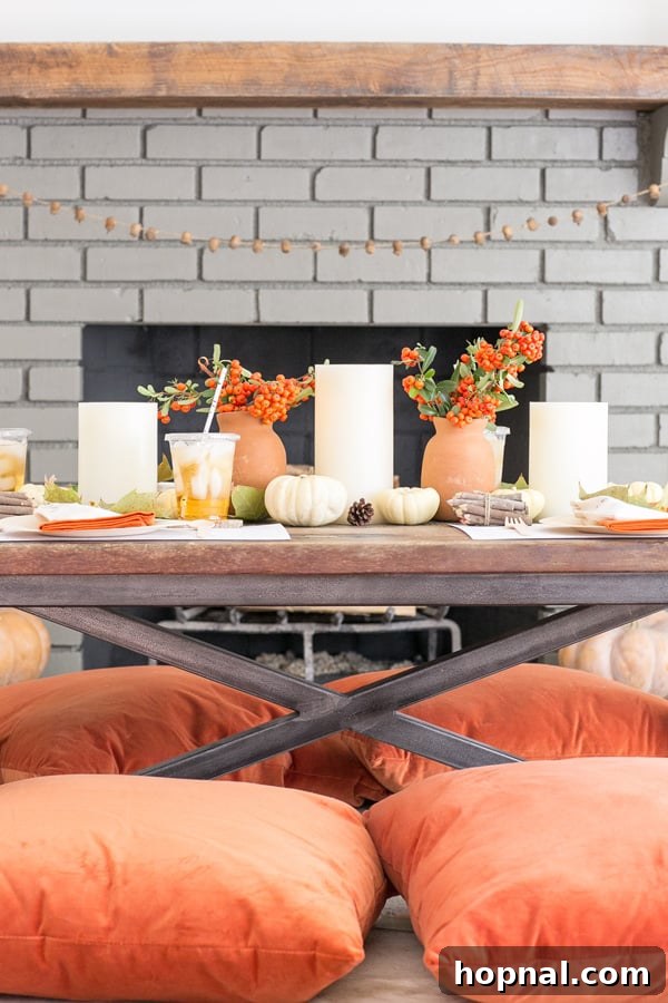 Little Gobblers' Thanksgiving Table 17 A vibrant Thanksgiving table set for kids, complete with orange pillows, fresh flowers, engaging games, and creative crafts, promising hours of fun.