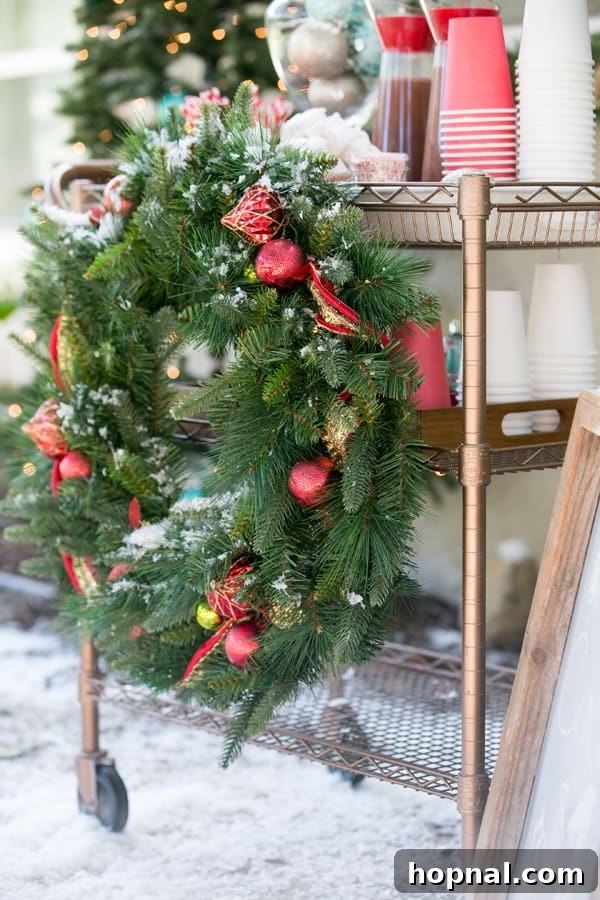 Elegant hot cocoa bar setup with a festive wreath and various toppings, creating a warm and inviting atmosphere.