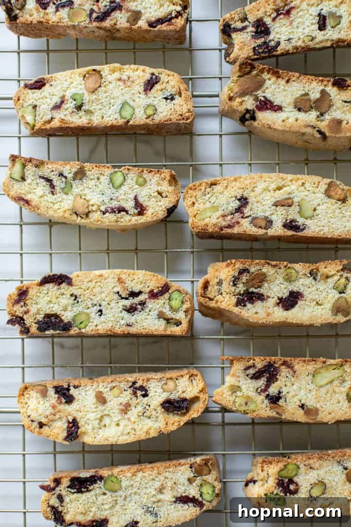 Jeweled Cranberry Pistachio Biscotti 12 Freshly sliced biscotti pieces arranged on a cooling rack after the second bake.