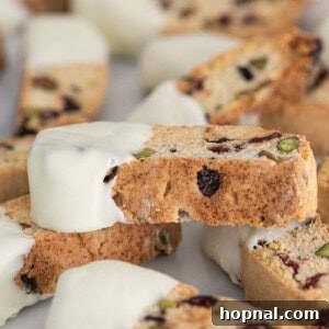 Jeweled Cranberry Pistachio Biscotti 14 Finished cranberry pistachio biscotti cookies dipped in white chocolate.