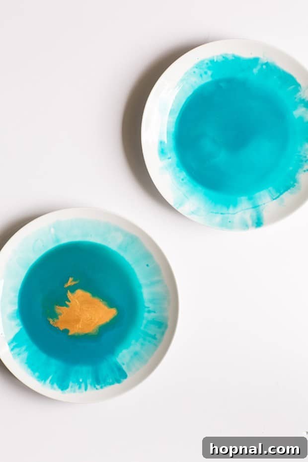 Close-up of turquoise watercolor plate with gold accents