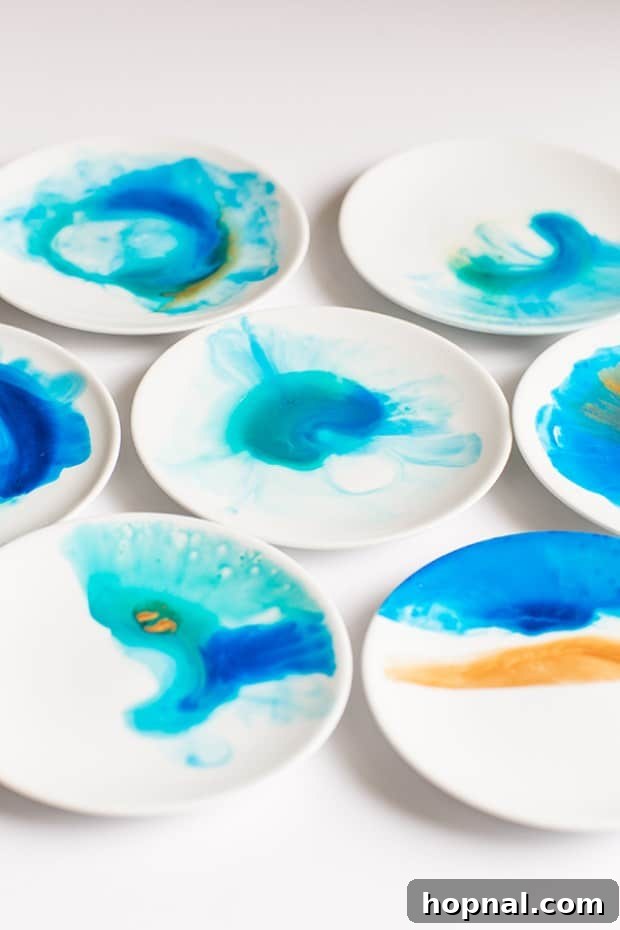 Watercolor plates with various shades of blue and turquoise paints