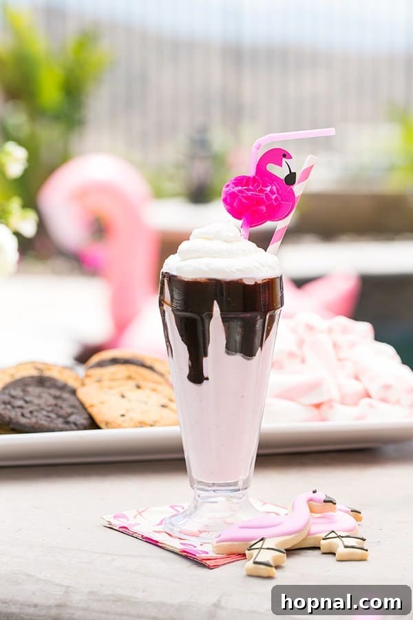 Delicious strawberry milkshake topped with chocolate sauce and whipped cream