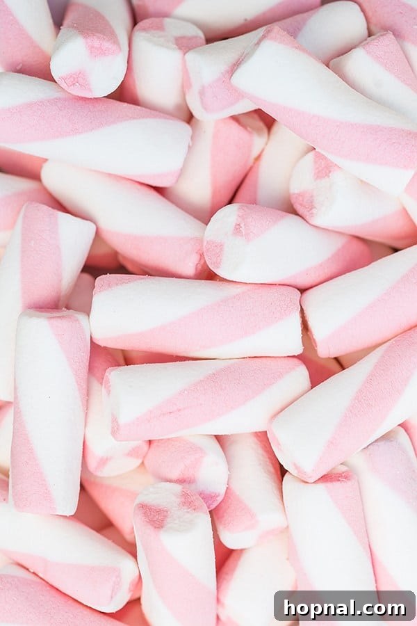 Close-up of pink and white striped marshmallows, adding a festive touch to desserts