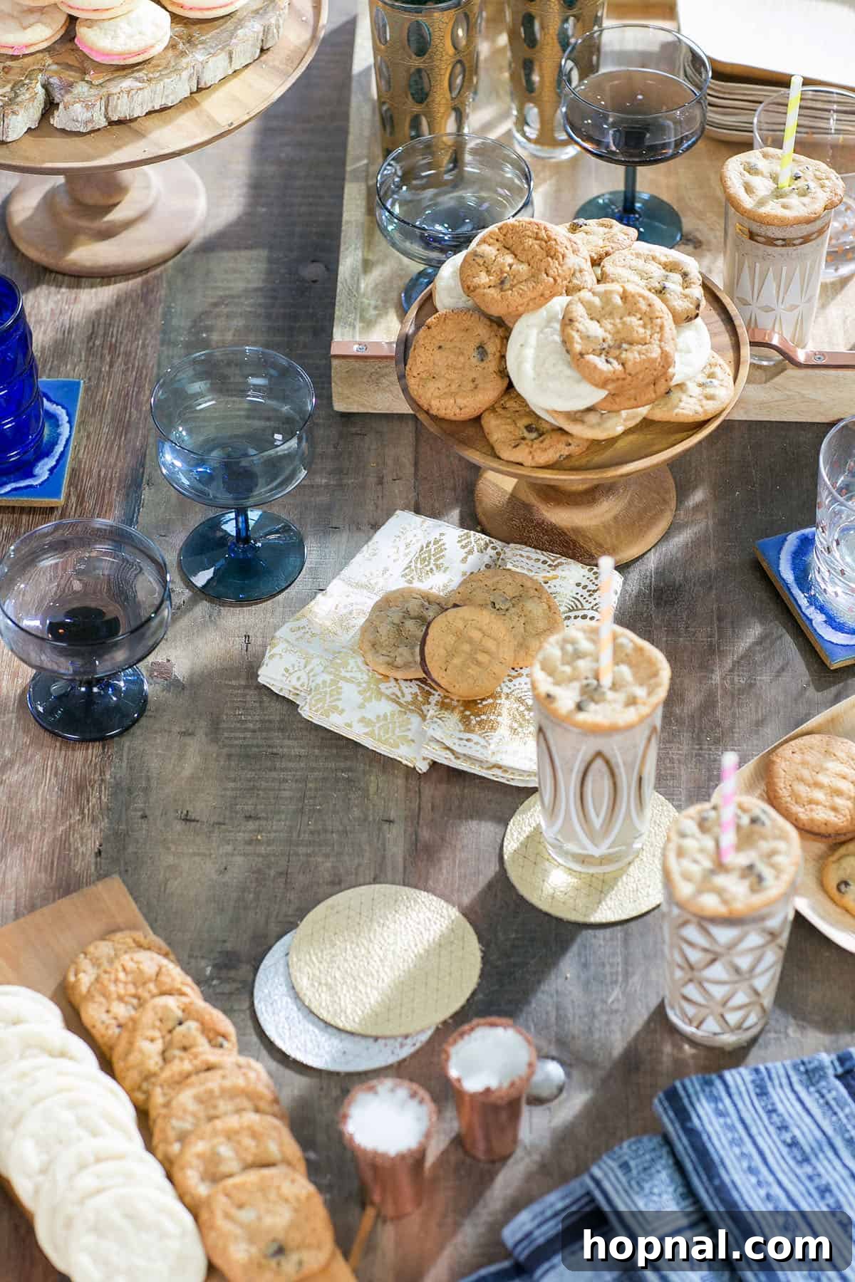 table filled with an elegant display of cookies and cocktails