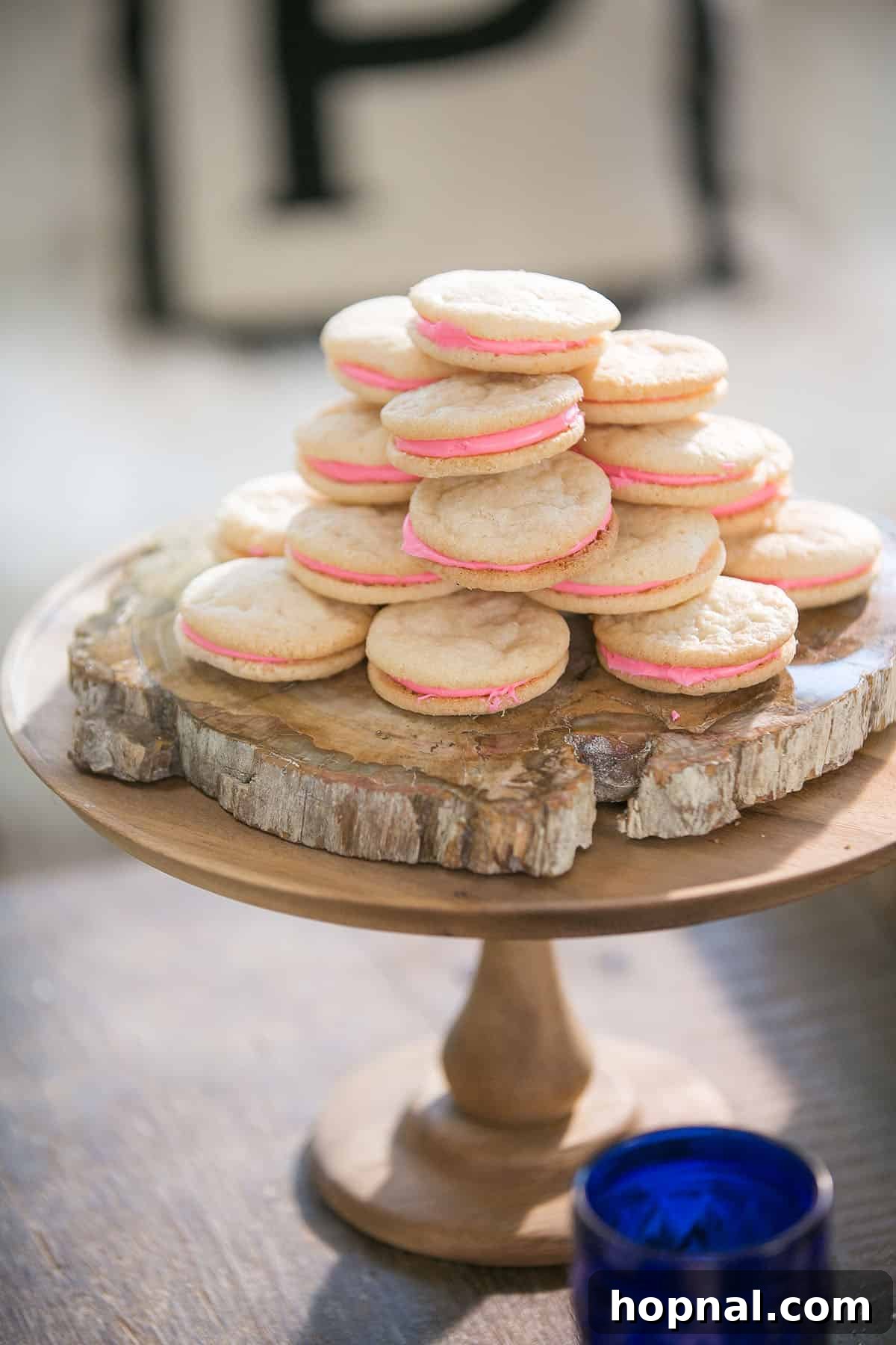 sugar cookies with vibrant pink filling, ready for a party