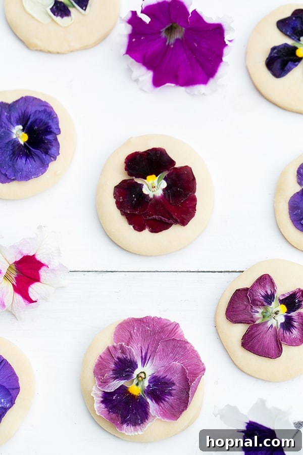 Shortbread cookies decorated with flowers on a wooden work surface