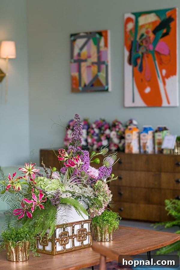 A beautifully arranged and colorful cocktail with fresh garnishes, ready to be served to a guest.