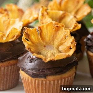 Pineapple flowers arranged beautifully on cupcakes, ready for serving.