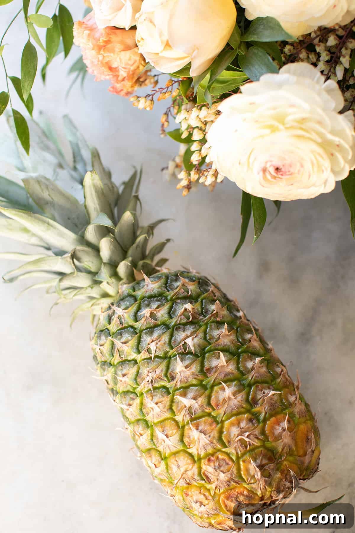 A vibrant, ripe whole pineapple, ready to be transformed into beautiful edible flowers.