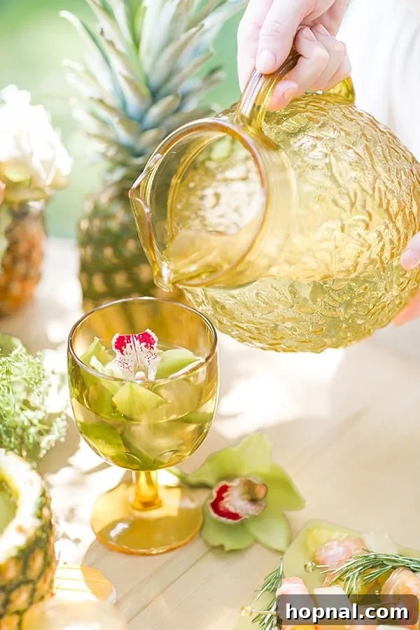 Close-up of water being poured into a stylish yellow glass.