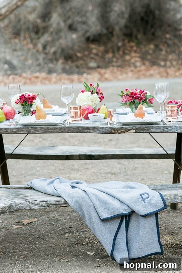 A rustic wooden table and bench setup in a natural outdoor setting, perfect for a casual Thanksgiving camping meal.