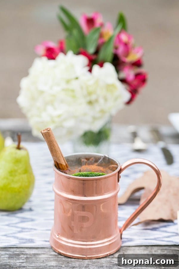 Close-up shot of a festive Moscow Mule cocktail, ideal for a Thanksgiving camping or glamping setup.