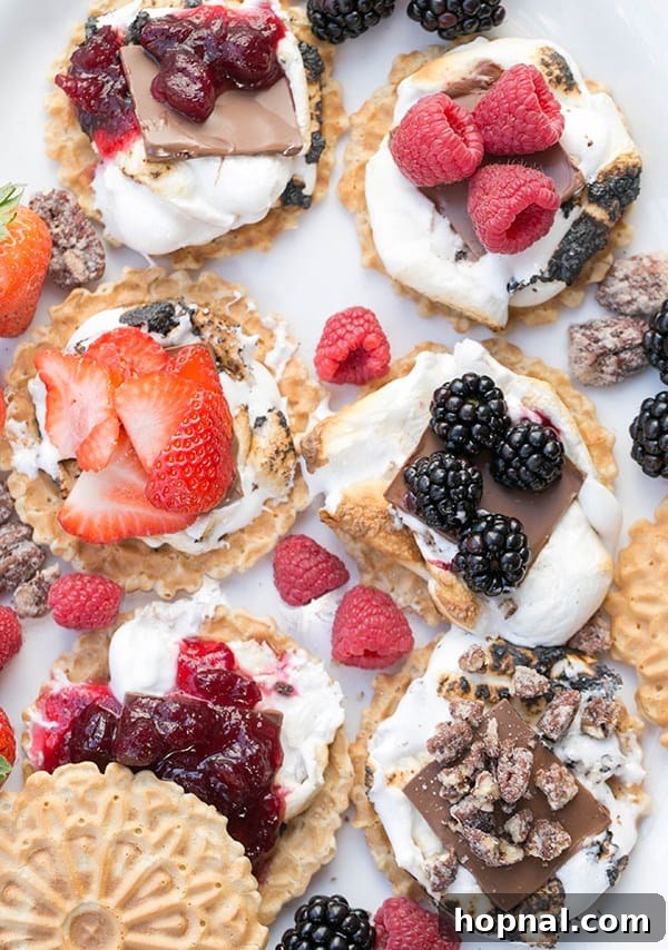 A rustic wooden table displaying a plate of s'mores with various gourmet toppings, perfect for a Thanksgiving camping trip.
