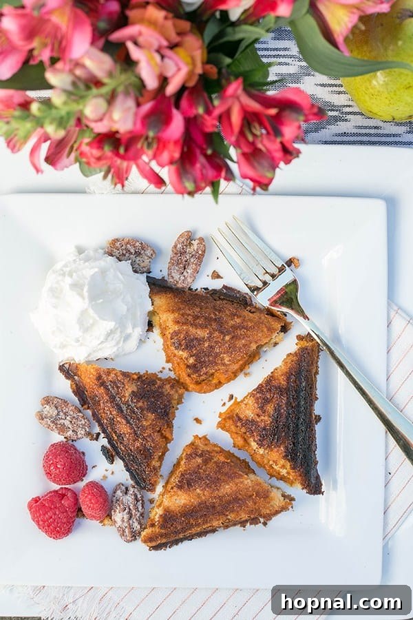 Delicious campfire pumpkin pie being cooked over an open fire, a perfect Thanksgiving camping dessert.