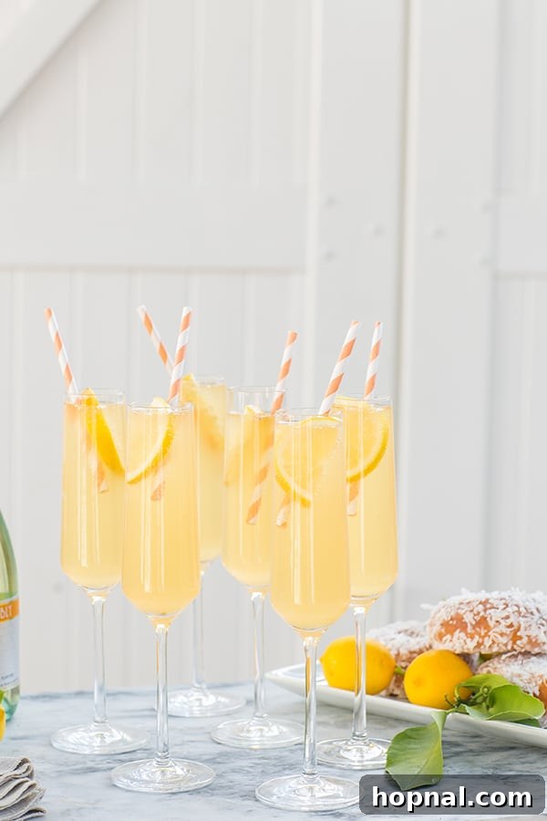 Side shot of peach punch in elegant glasses, ready for serving at a party