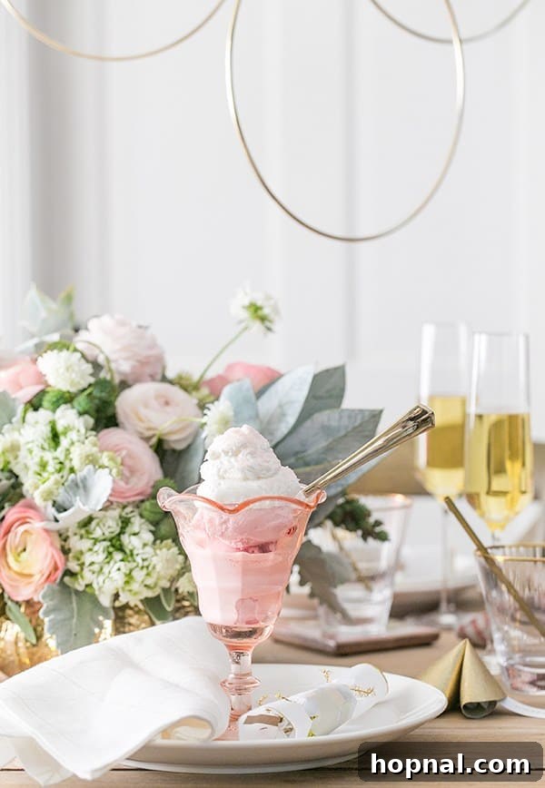 A delightful scoop of ice cream served in a chic pink glass, a sweet ending for a New Year's Eve dinner.