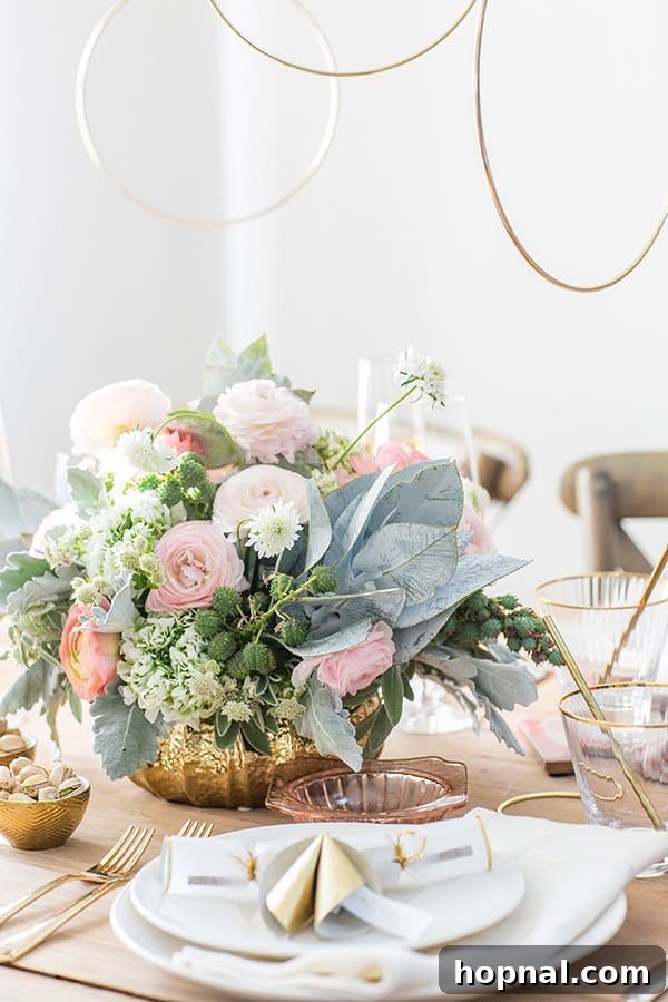 A beautifully decorated New Year's Eve table with a lush floral centerpiece and gold accents, inviting guests to celebrate.