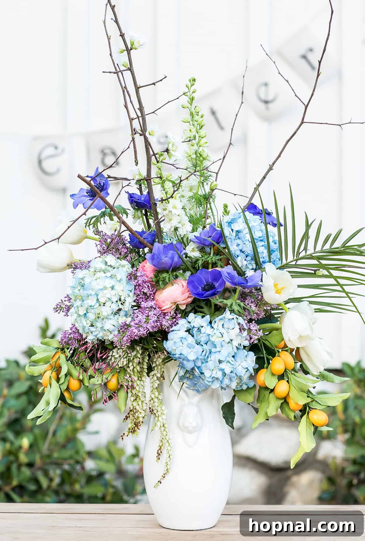 Easter party ideas for flower arrangements featuring vibrant spring blooms in small glass vases, contributing to a colorful and inviting table decor.