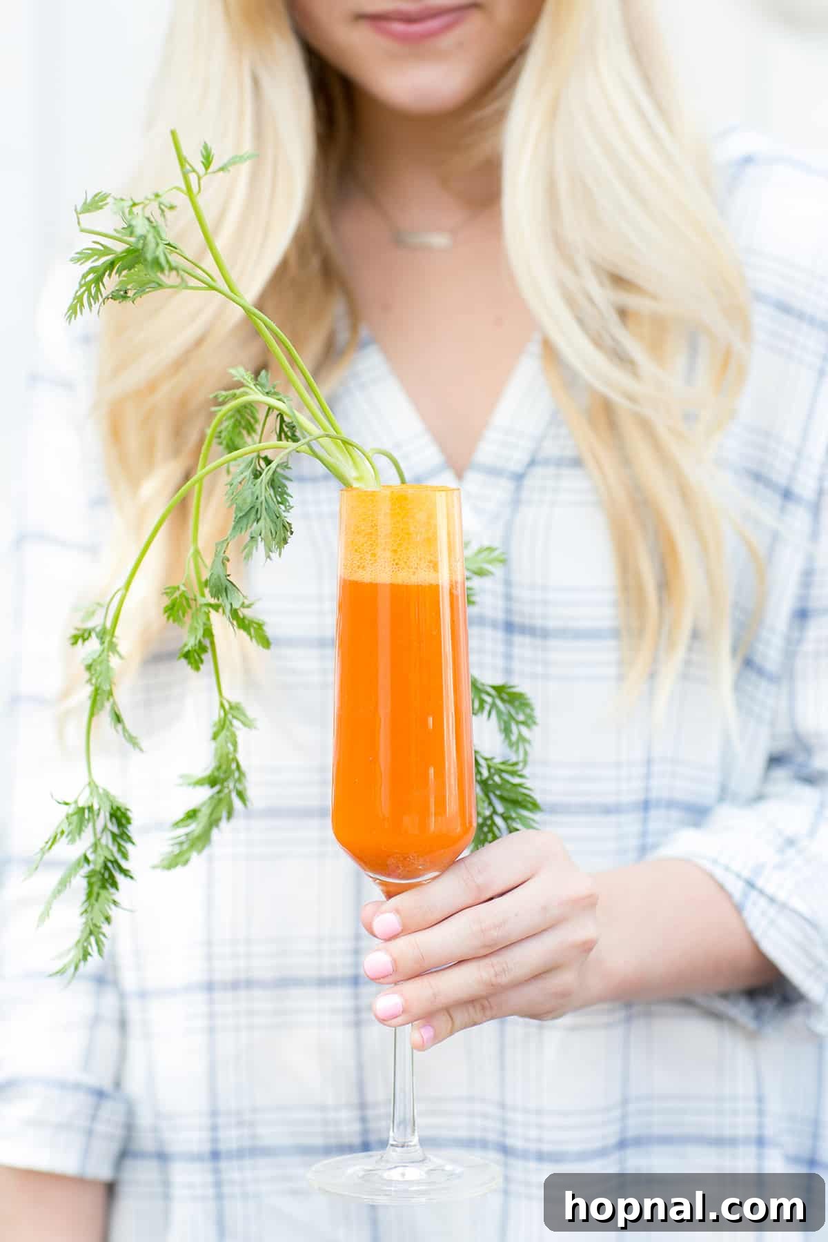 Carrot and blood orange mimosa, a vibrant and refreshing cocktail perfect for an Easter celebration, adding a unique twist to brunch drinks.