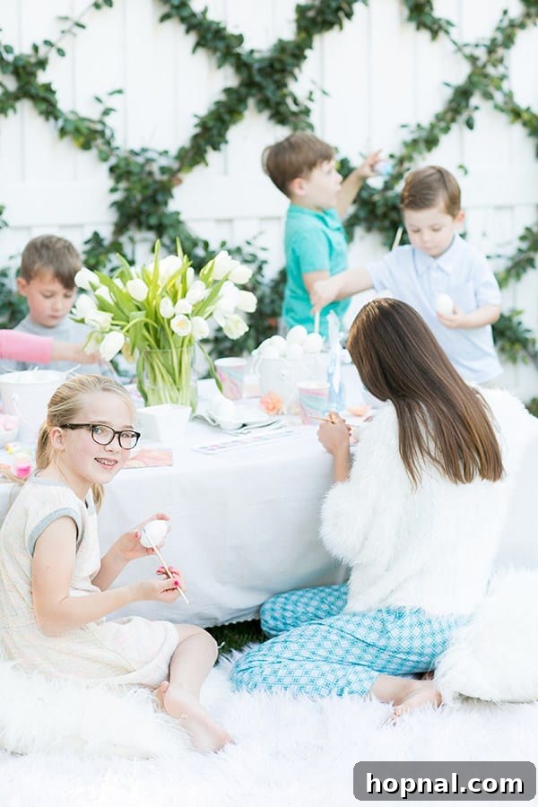 Dyeing for Easter Fun 3 Happy children sitting around a festive table at an Easter party, intently decorating hard-boiled eggs with paints and brushes.