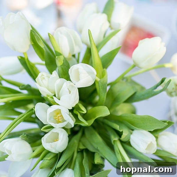 Dyeing for Easter Fun 21 A beautiful vase filled with fresh, vibrant tulips, adding a touch of spring elegance and natural beauty to the Easter decor.