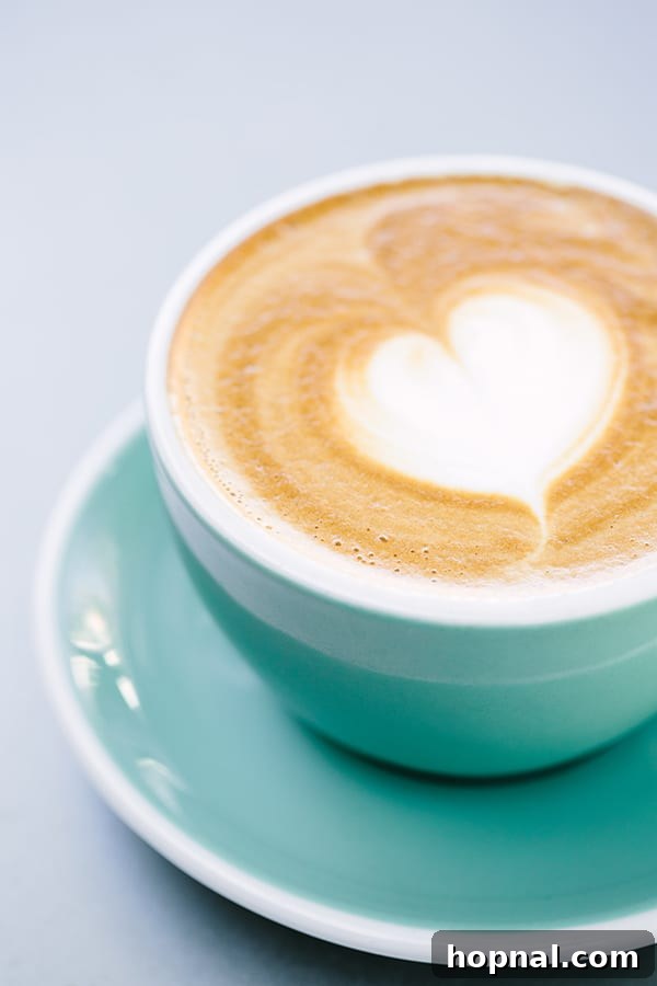 Latte in green cup with a heart
