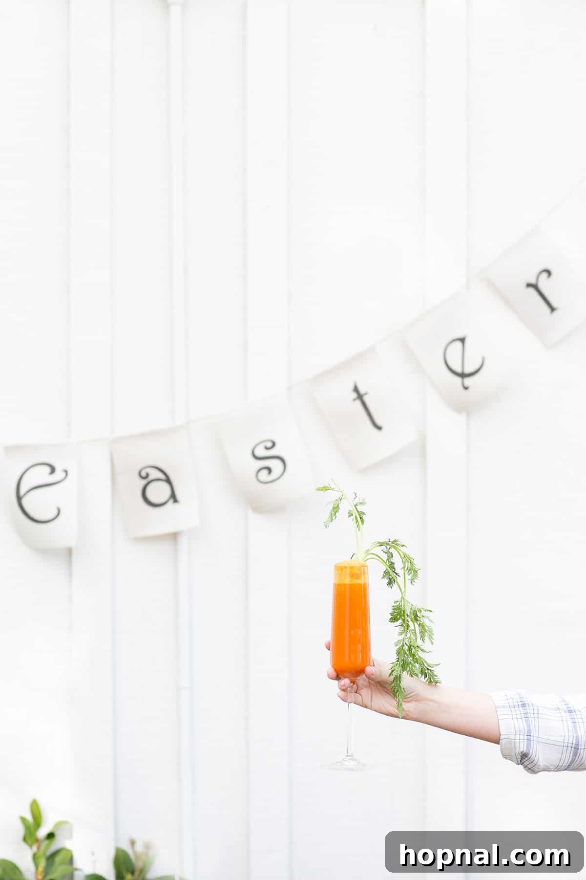 Beautifully prepared Mimosa for Easter, featuring carrot juice and sparkling white wine, garnished for a festive touch.