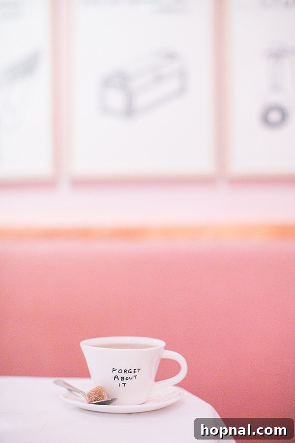 A teacup with 'Forget About It' written on it at Sketch London