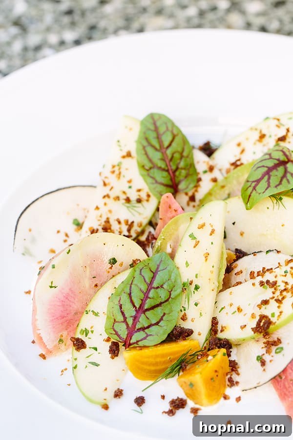 A fresh, gourmet salad with pears served at Viviane restaurant, highlighting its refined American and European cuisine.