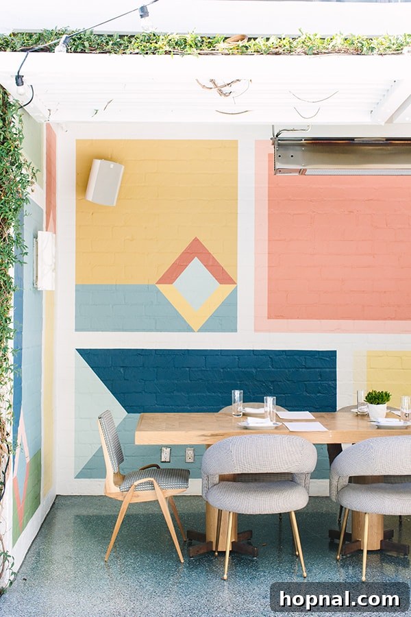 A vibrant, colorful block wall at Viviane restaurant in Los Angeles, reflecting Kelly Wearstler's bold design choices.
