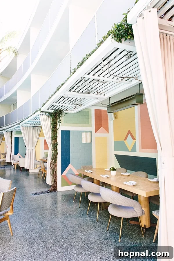 The inviting and colorful outdoor patio area at Viviane, designed for relaxation and enjoyment in Beverly Hills.