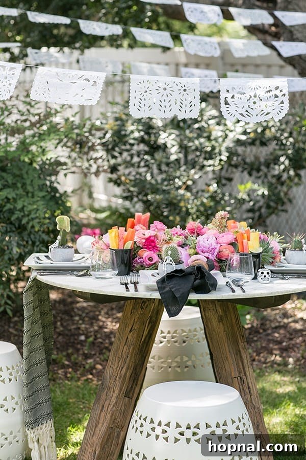 Spice Up Your Cinco de Mayo Celebration 2 Cinco de Mayo table setting with pink flowers, fruit and benches.
