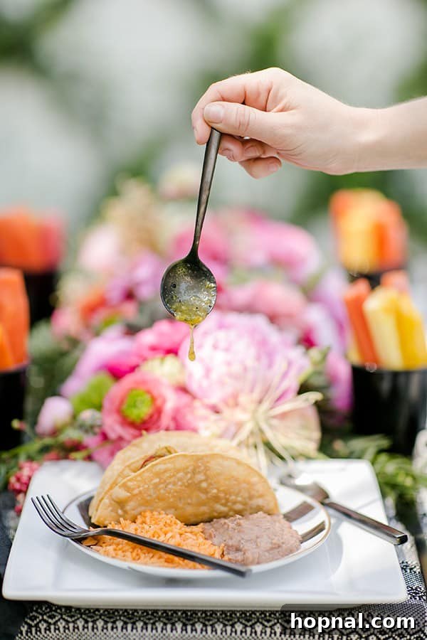 Spice Up Your Cinco de Mayo Celebration 7 Black spoon with salsa pouring onto a taco for Cinco de Mayo