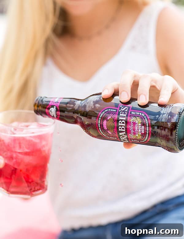 Girl pouring ginger beer into a glass
