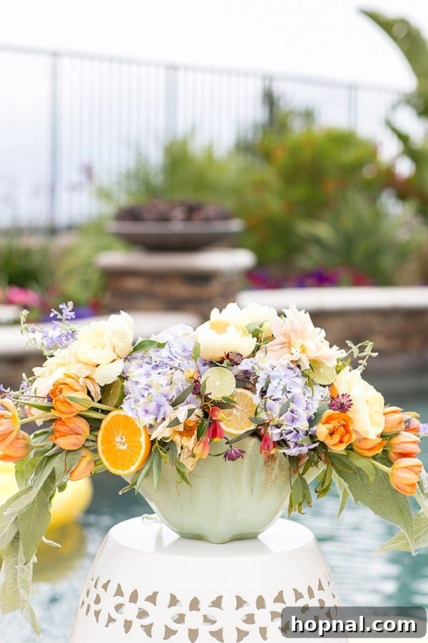 Flower arrangement on a garden stool at a pool party