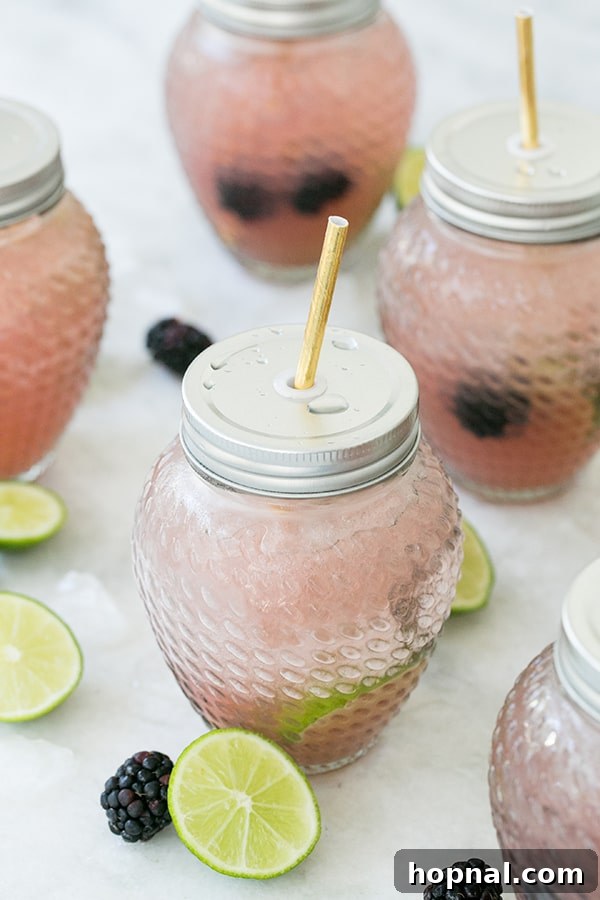 side shot of blackberry margaritas - lime juice
