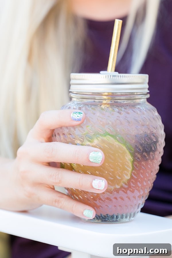 shot of hand holding the cocktail - margarita glass