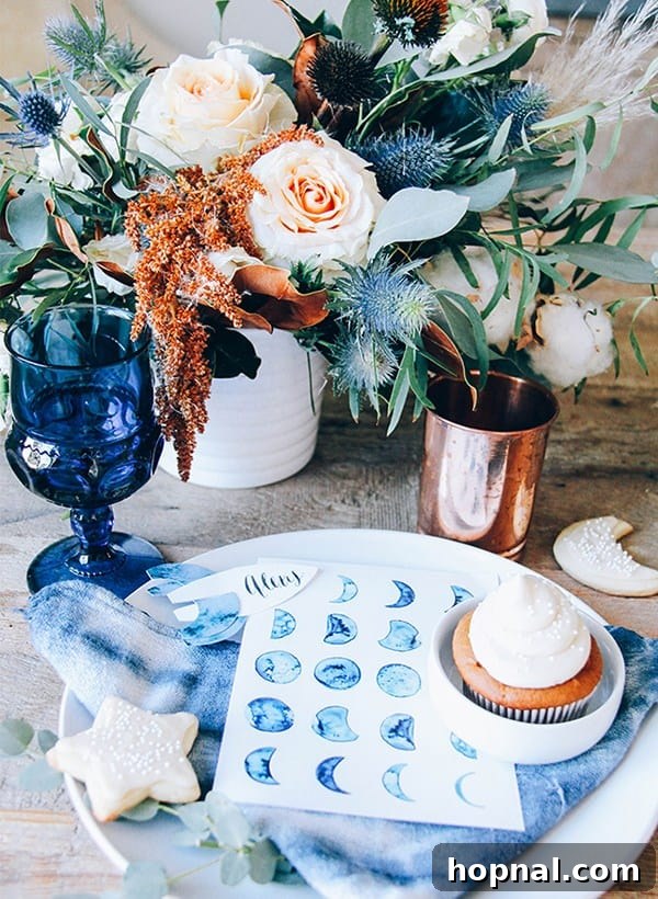 10 Picture-Perfect Baby Shower Celebrations 4 Dreamy celestial themed baby shower decor featuring deep indigo hues, sparkling starry elements, and prominent moon motifs, creating a magical atmosphere.