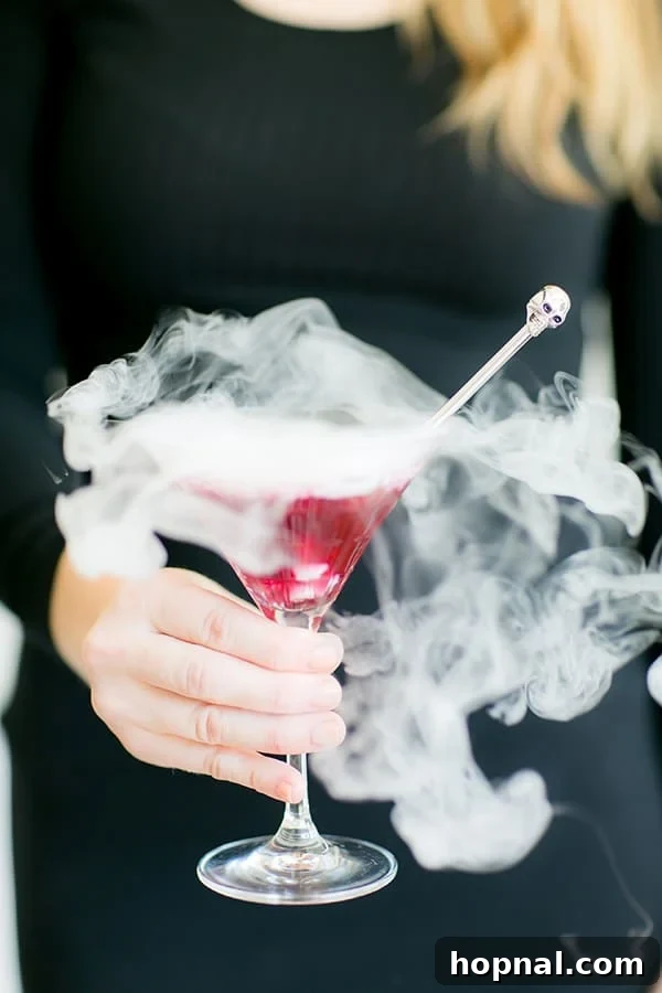 Close-up shot of a blueberry cocktail with a smoky effect