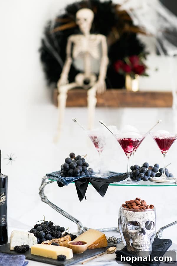 Three smoking blueberry cocktails on a table, ready for a party