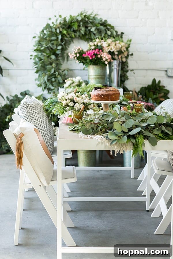 Greenery and Good Times Wreath Party 3 Beautifully arranged dessert table with cakes and festive treats at a holiday wreath making party