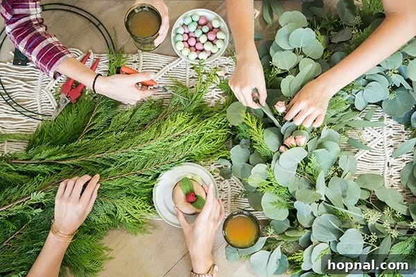 Greenery and Good Times Wreath Party 8 Top-down view of guests actively engaged in the wreath making process, arranging greens and flowers