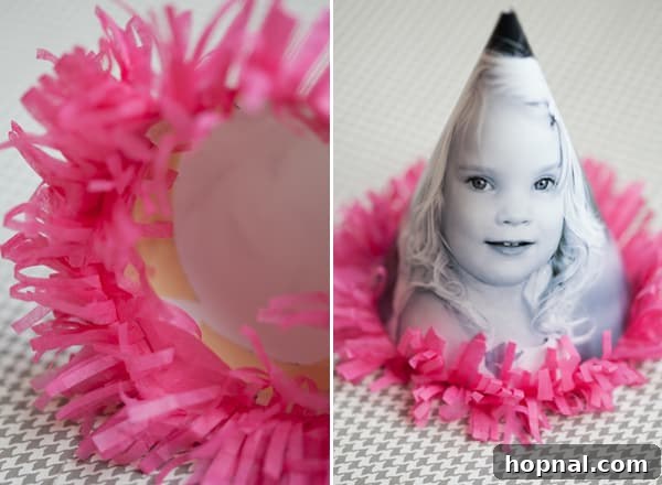 Personalized Photo Celebration Hats 6 A close-up image of a finished DIY party hat adorned with a delicate fringe around its bottom edge, highlighting the decorative detail.