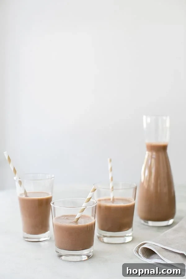 3 glasses of almond chocolate almond milk, side on shot