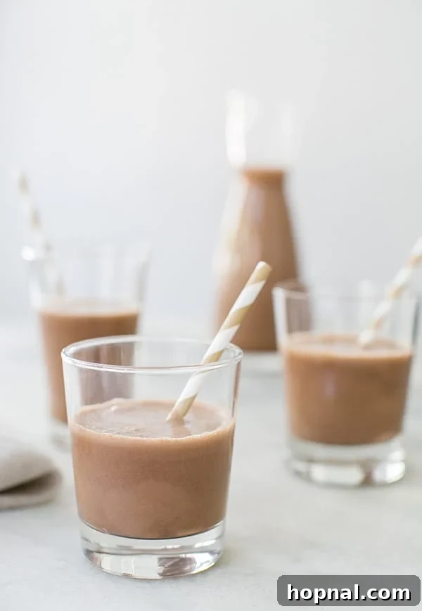 side on, close up shot of milk in glasses