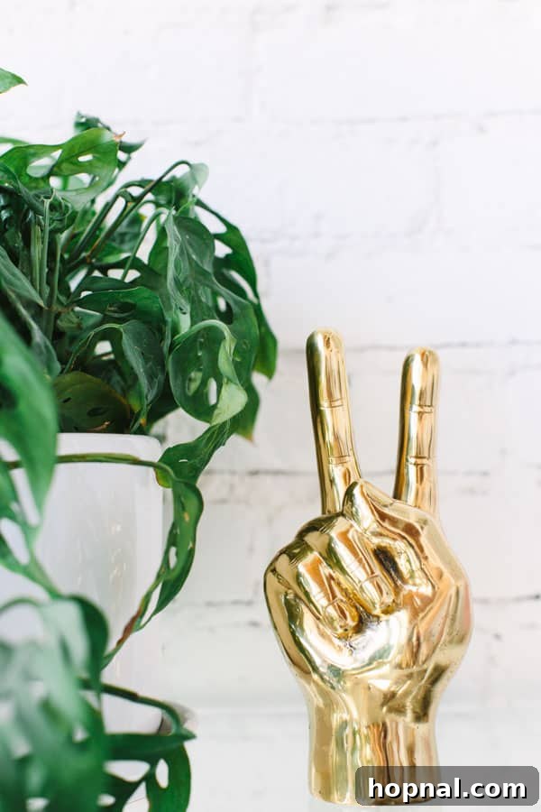 A decorative gold peace sign hand, adding to the quirky details of the bakery's branding.